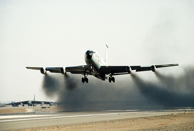 Soot behind an old jet aircraft